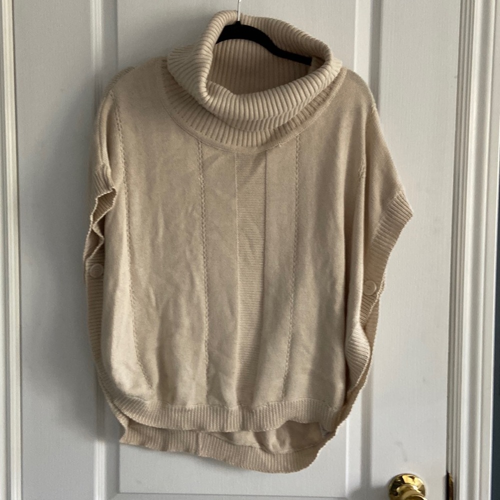 Poncho type knit sweater